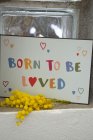 Metallskylt "Born to be loved"