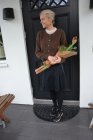 Kofta brun med blomsterknappar